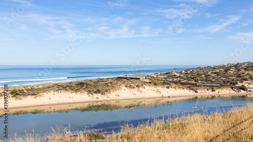 two stand up paddle boarders on the onkaparinga river located in port noarlunga south australia on November 27th 2020