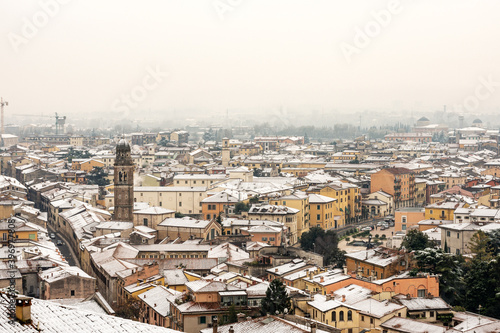 Aerial view of Verona downtown in winter with snow with the Church of San Tommaso Becket Cantuariense in gothic style (XIV-XVI century). Veneto, Italy, Europe.