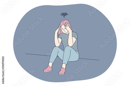 Sadness, mental depression, bad news concept. Young unhappy woman sitting touching head with hands feeling depressed with thoughts after negative events, crying, suffering from loneliness