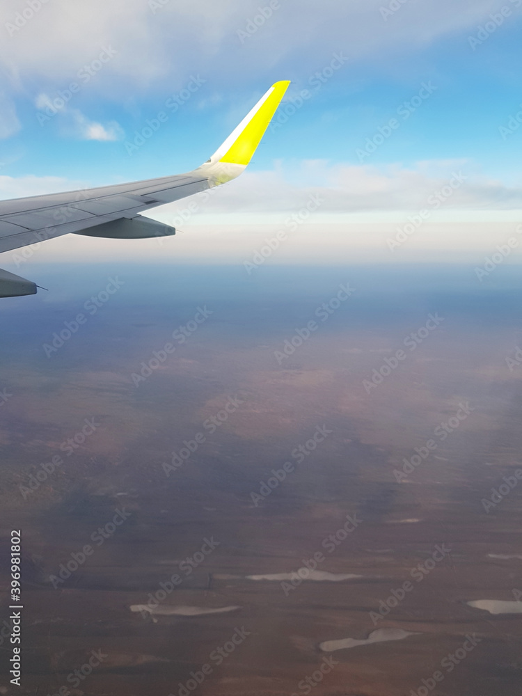 Wing aircraft in the blue sky