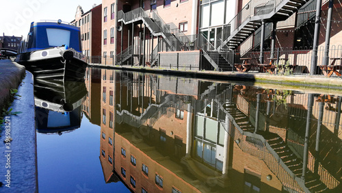 Close-up view of the Birmingham Canal with reflected buildings
