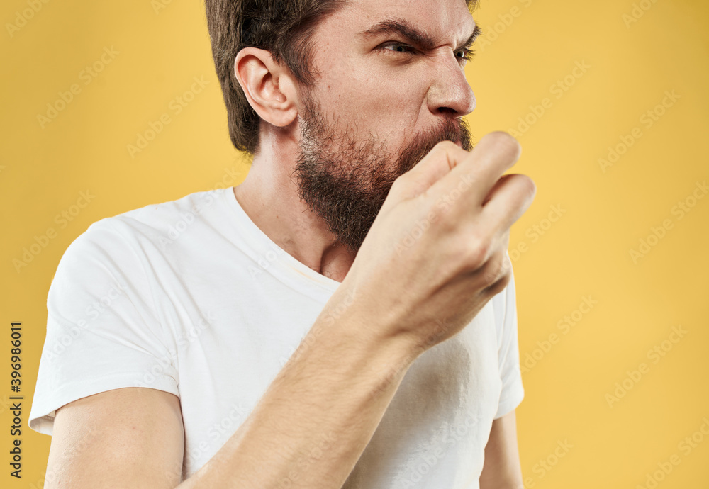 Fototapeta premium Angry man in white T-shirt mental deviation thick beard model
