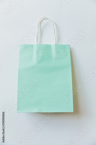 Simply minimal design shopping bag isolated on white background. Online or mall shopping shopaholic concept. Black friday Christmas season sale. Flat lay top view copy space, mock up