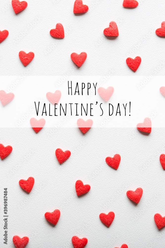 red and white pattern background. hearts are evenly spread out on surface. text happy Valentines day red and white pattern background. hearts are evenly spread out on surface. text happy Valentines day