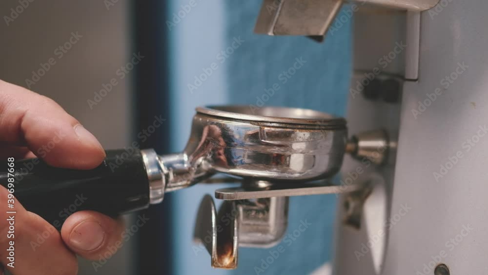 Barista makes coffee in coffee bar. pouring coffee Close up coffee preparing in white ceramic cup from automatic coffee maker machine. Barista makes coffee in coffee bar. pouring coffee Close up coffee preparing in white ceramic cup from automatic coffee maker machine.