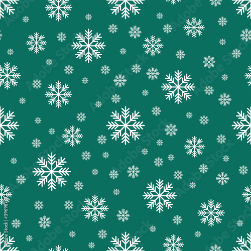 The seamless pattern with the white snowflakes on the green background. The save with the Clipping Mask.
