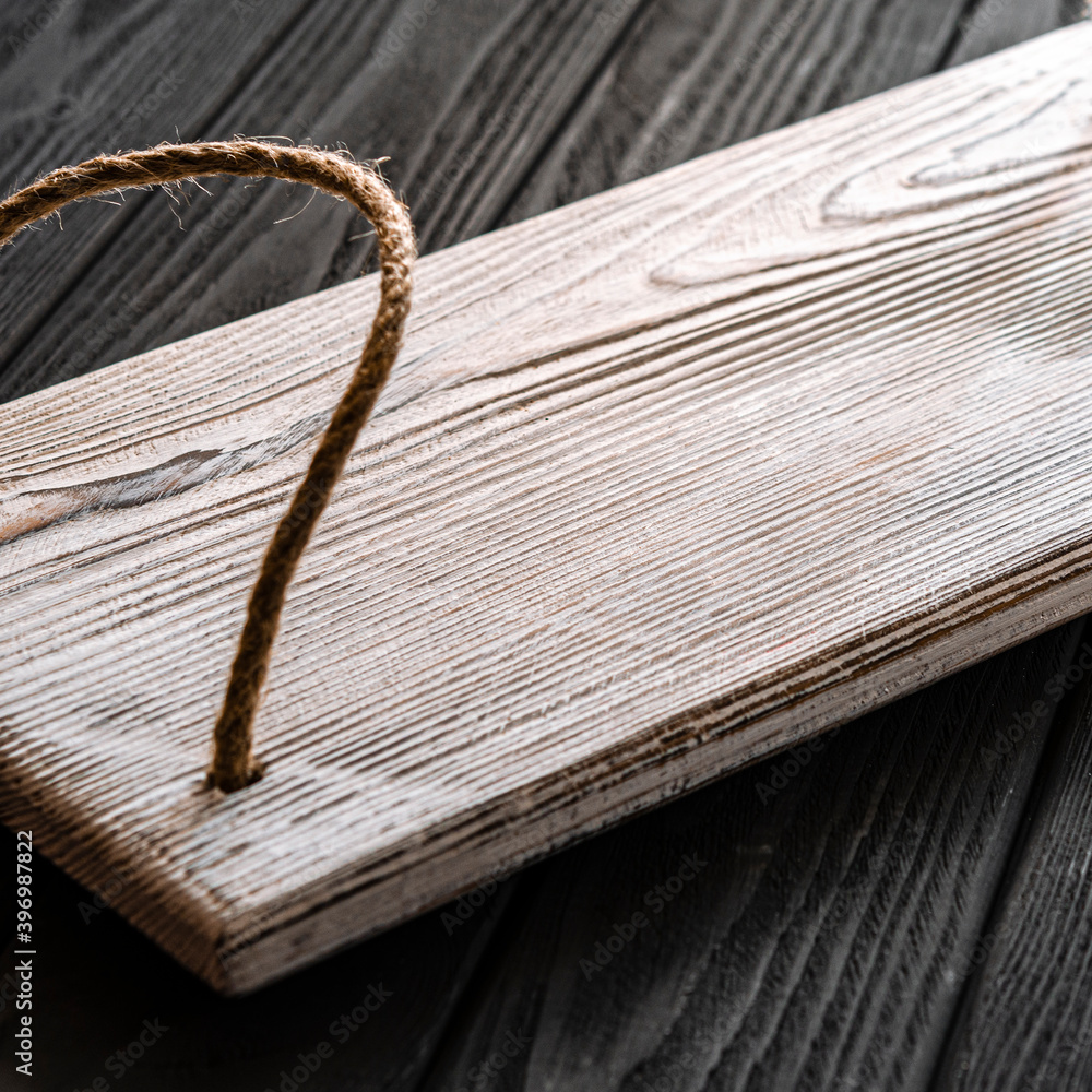 Fototapeta premium A white wood tray for tea and coffee stands on a wood table