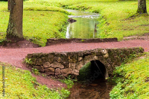 Bridge over a small stream in the lower park of Peterhof, Petrodvorets, St. Petersburg