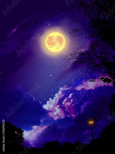 Background of beautiful yellow full moon and clouds in starry space