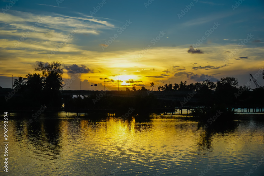 Beautiful bright sunset over the river in Malaysia