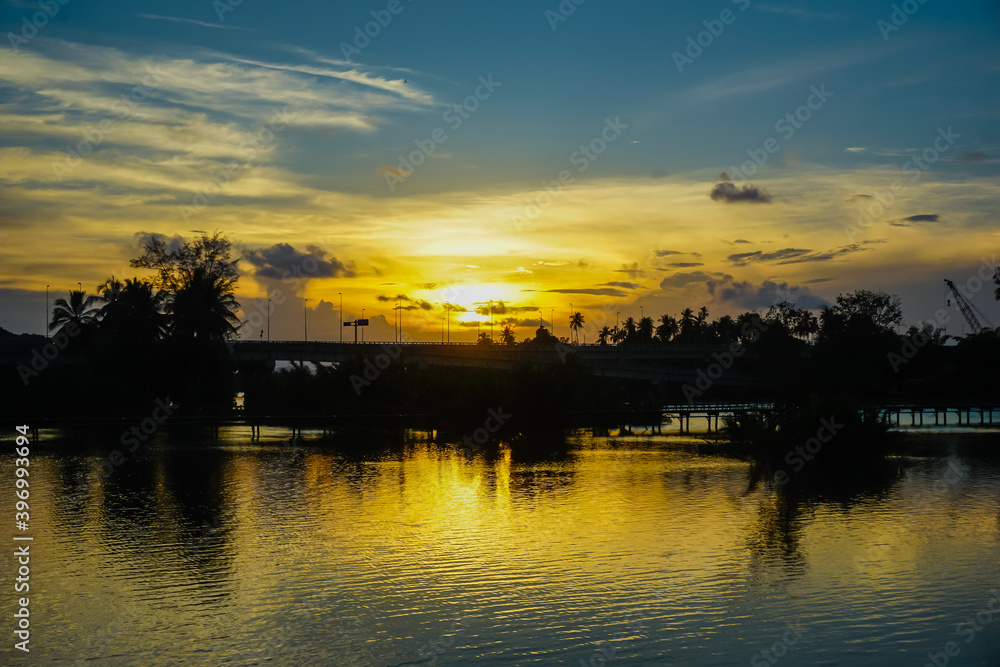 Beautiful bright sunset over the river in Malaysia Beautiful bright sunset over the river in Malaysia
