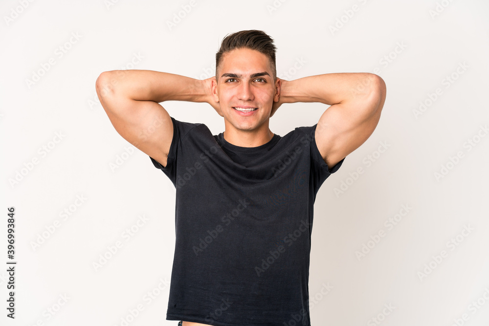 Young caucasian handsome man isolated feeling confident, with hands behind the head.