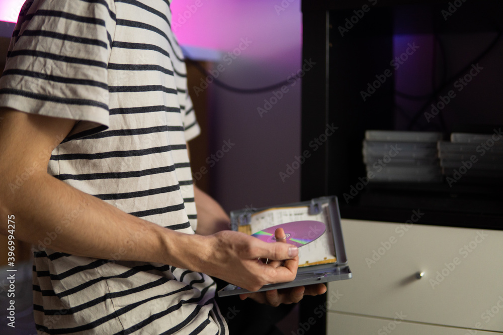 Unrecognizable man choosing a CD game. Unrecognizable man choosing a CD game.