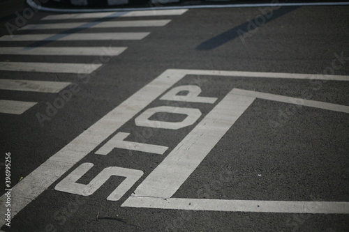 stop sign on asphalt in three-way junction road