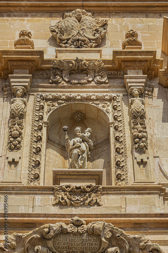 Elche Santa Maria Basilica (XVII century) at Plaza de Santa Maria is built on the foundations of old mosque. Architectural fragments of Venetian baroque facade of Santa Maria Basilica. Elche, Spain.