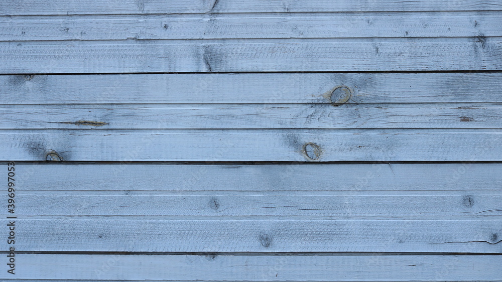 Fototapeta premium knotted textured wooden background from horizontal narrow planks with unique cutaway wood pattern, exterior and interior natural light wood background, empty embossed surface in rustic style
