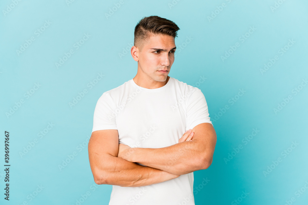 Young caucasian handsome man isolated tired of a repetitive task. Young caucasian handsome man isolated tired of a repetitive task.