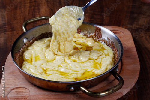 Mihlama (kuymak) is a famous traditional food from Turkey. It is prepared with corn meal and cheese. photo