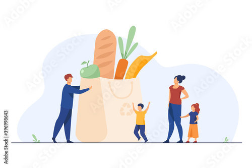 Tiny family at grocery bag with healthy food. Parents, kids, fresh vegetables flat vector illustration. Healthy nutrition, healthcare, lifestyle concept for banner, website design or landing web page