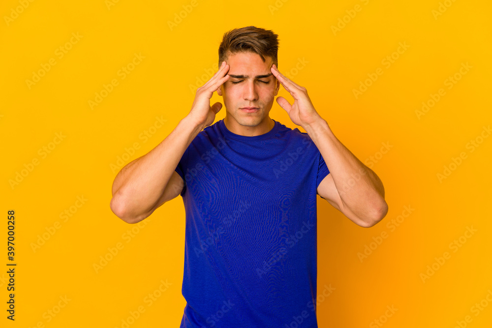 Young handsome caucasian man isolated touching temples and having headache. Young handsome caucasian man isolated touching temples and having headache.