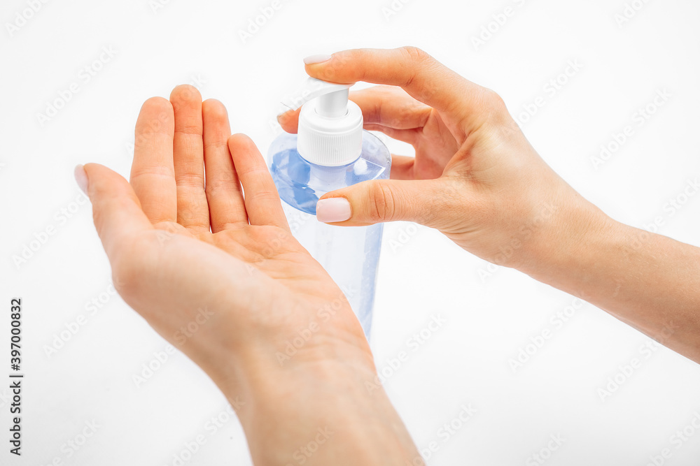 Disinfection of hands. hands applying antiseptic spray to prevent coronavirus or flu, on a white background, Disinfection of hands. hands applying antiseptic spray to prevent coronavirus or flu, on a white background,