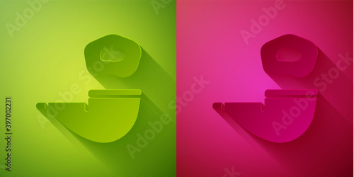 Paper cut Smoking pipe with smoke icon isolated on green and pink background. Tobacco pipe. Paper art style. Vector.