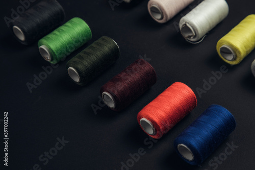 colorful threads on the black background