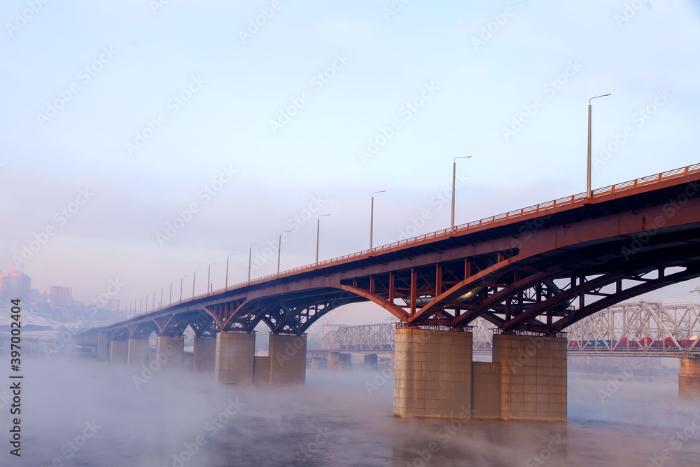 Bridge in the fog in winter, Krasnoyarsk, Yenisei river Bridge in the fog in winter, Krasnoyarsk, Yenisei river