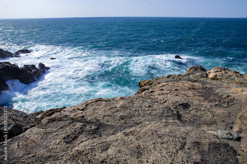 日本海の荒波と海食崖の風景　島根県出雲市大社町　The view of raging waves of the Sea of Japan and the cliff in Taisha town, Izumo city, Shimane pref. Japan