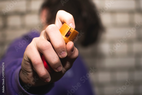 young guy defends himself with pepper spray