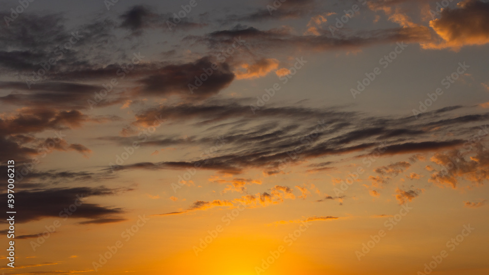 Dramatic sunset with Red,Orange,Yellow Clouds and Background Pastel Blue Sky.