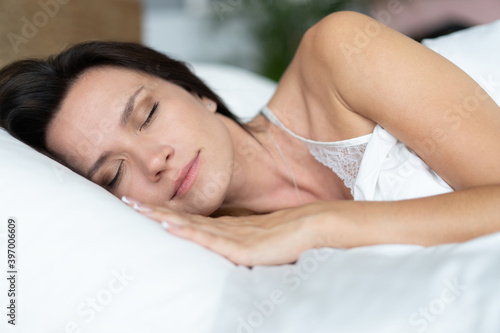 beautiful girl sleeps in the bedroom.
