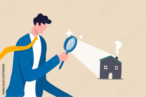 Searching for new house, look for real estate and accommodation valuation or new rent and mortgage concept, smart businessman using magnifying glass zooming to see house or residential details.