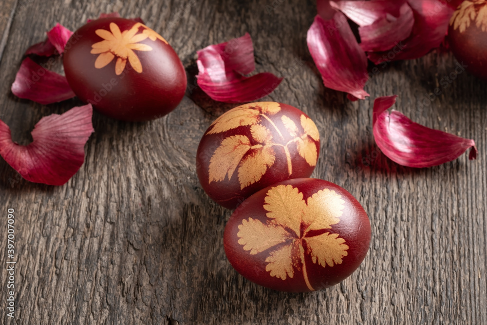 Easter eggs dyed with onion peels on a table, close up Easter eggs dyed with onion peels on a table, close up