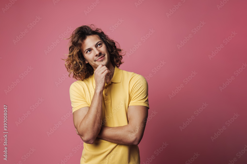 Happy handsome unshaven guy smiling and looking upward Happy handsome unshaven guy smiling and looking upward