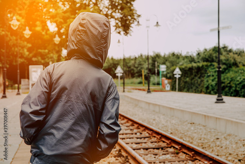 The boy at the train station. Little boy looking for a train, travel concept.