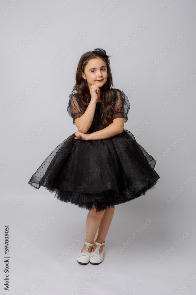 little girl in a beautiful dress on a white background little girl in a beautiful dress on a white background