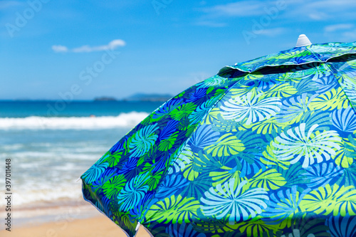 Close up of parasol in a tropical beach of Brazil. Summer vacation concept. Image for travel websites. photo