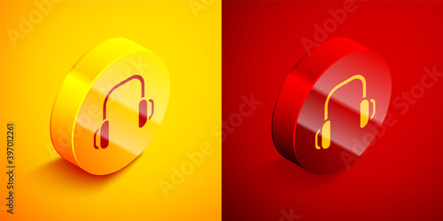 Isometric Winter headphones icon isolated on orange and red background. Earmuffs sign. Circle button. Vector.