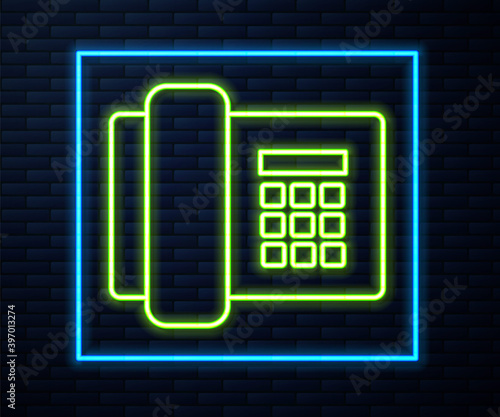 Glowing neon line Telephone icon isolated on brick wall background. Landline phone. Vector Illustration.