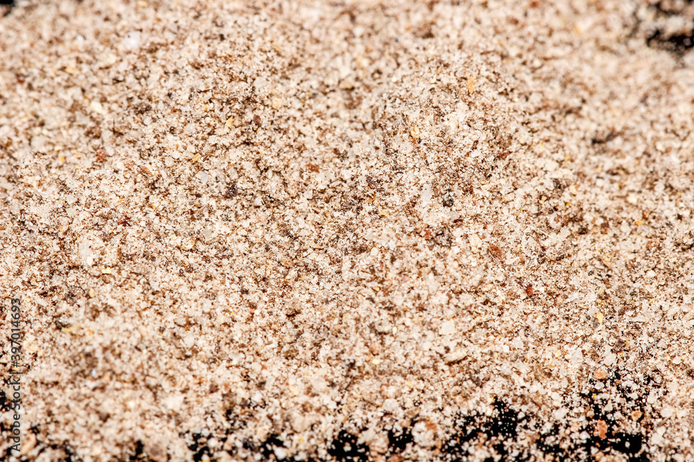 Macro photography of ground black pepper on a black background. Macro photography of ground black pepper on a black background.