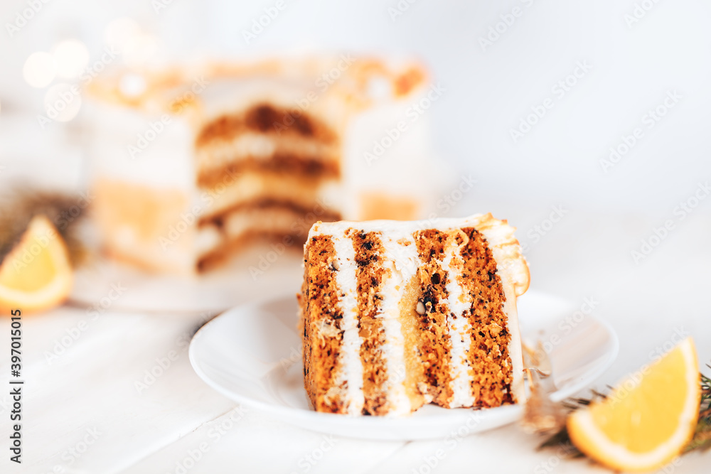 Slit cake on a white plate with a fork. Sweets for any holiday. On against a white background. Piece of cake on a white plate Slit cake on a white plate with a fork. Sweets for any holiday. On against a white background. Piece of cake on a white plate