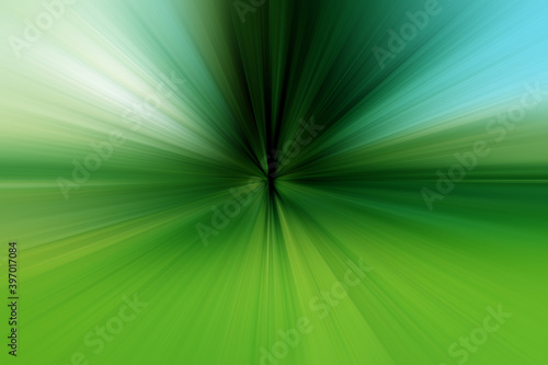Abstract dark green and blue zoom effect background. Rays of green and blue light. Colored radial blur, fast zoom, solar or stellar flares. Use for banner background