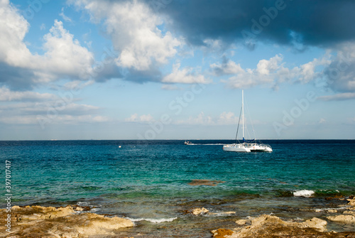 Cozumel Island Rocky Shore And Catamaran