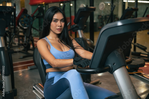 fitness woman with training machine in gym