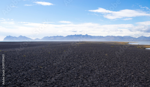 Hvalnes peninsula with a black pebble beach. East Iceland.
