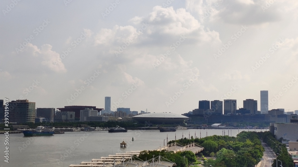 Fototapeta premium Huangpu River near Mercedes-Benz Arena (Shanghai). Houses and skyscrapers. China. Asia