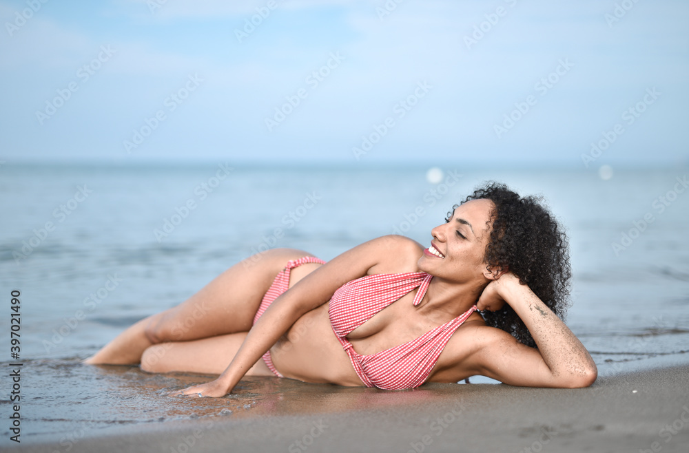 young woman lying on a beach young woman lying on a beach