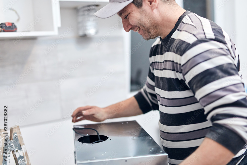 Handyman worker fixing and assembling household furniture. Handyman worker fixing and assembling household furniture.