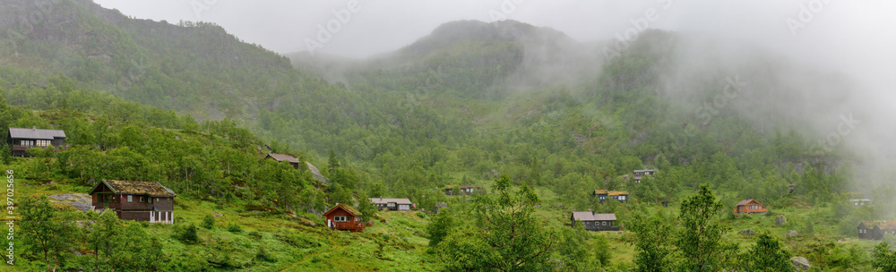 Norwegian style holiday cottages in the misty mountains of northern Norway.